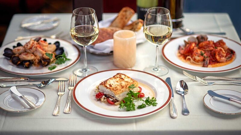 Three plated entrees focused on fish.